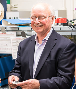 Harry Tuller smiles for a picture in the lab.