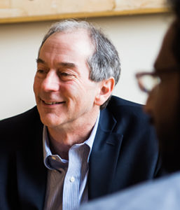 John Lienhard smiles for a casual photo while in conversation.