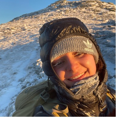 Carolina takes a selfie in warm early morning sunlight, eyelashes coated with ice.