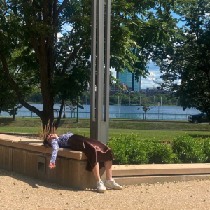 Me (Isabela) laying down in the sun outside of the Sloan Building.