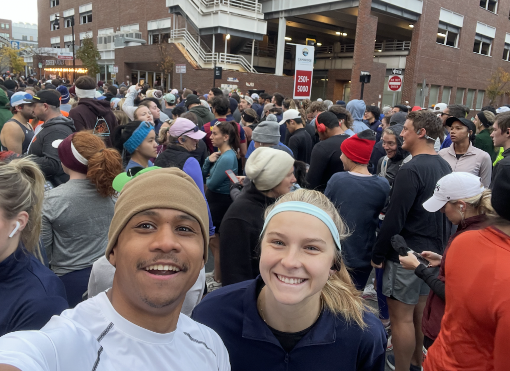 A blonde woman smiles in a running headband