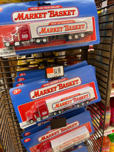 Market Basket toy trucks are displayed for $4.99 each